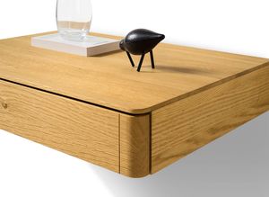 float bedside cabinet made of wood with rounded corners