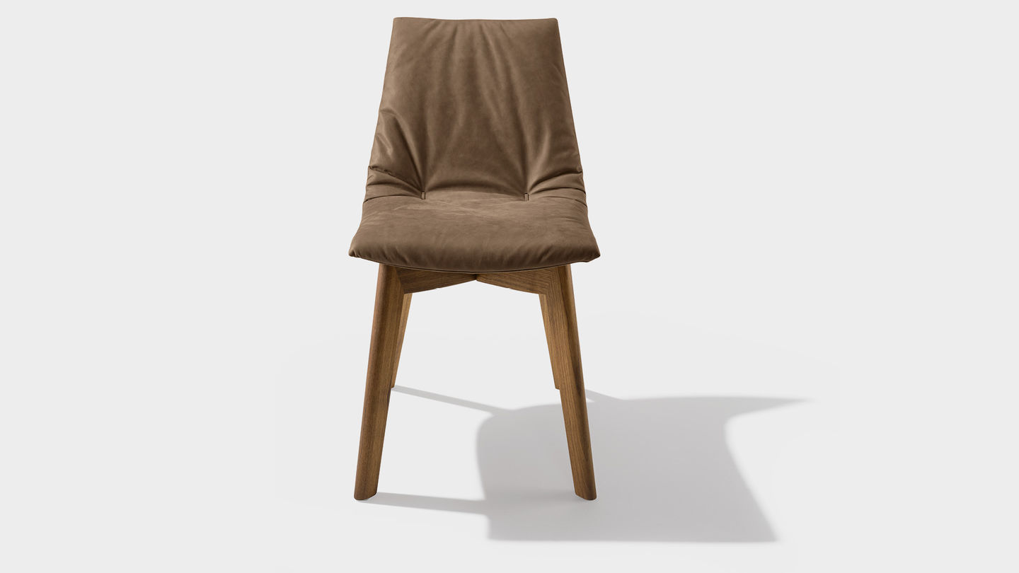 lui chair with leather tarfufo, and wooden legs