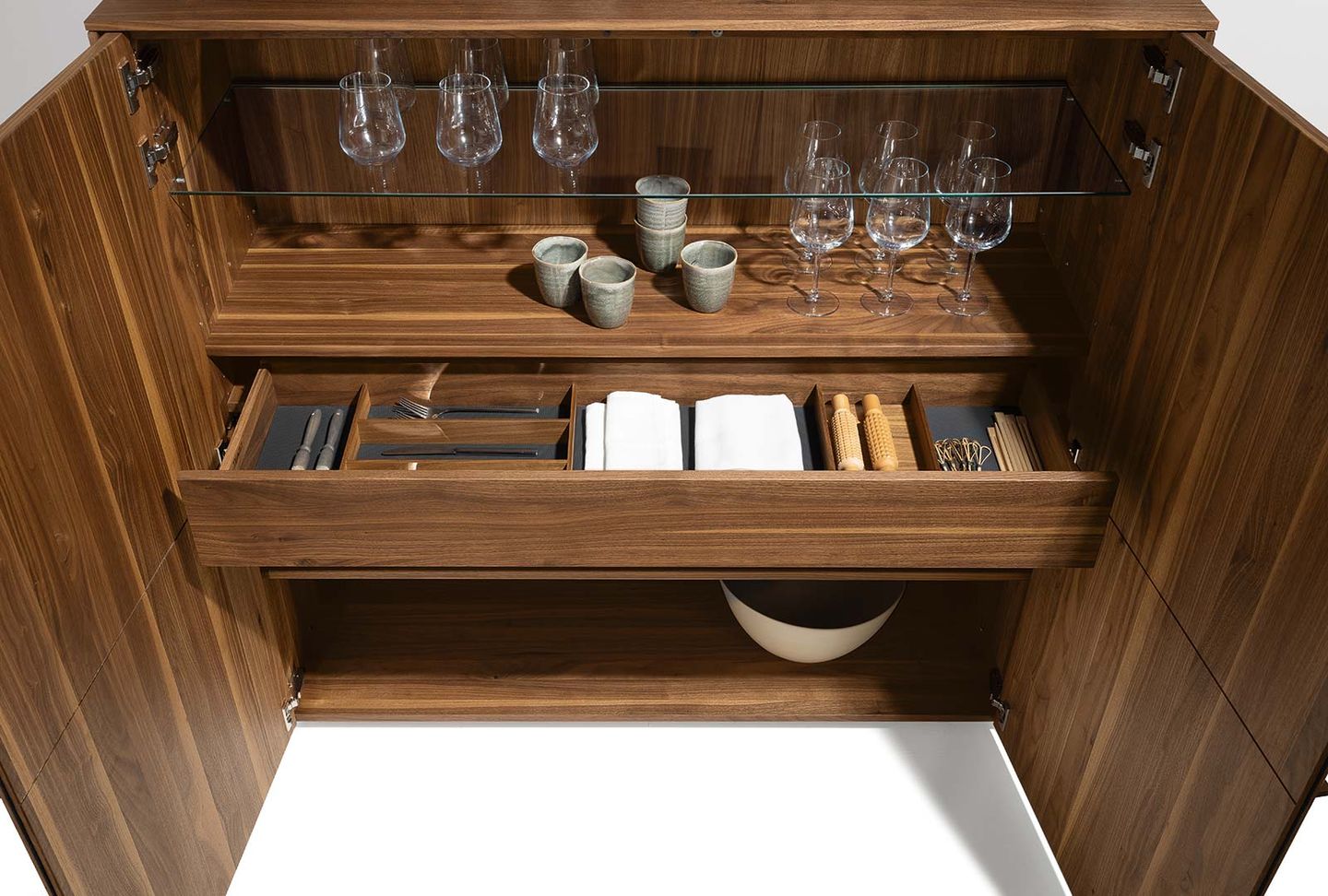 filigno highboard with a practical interior in walnut