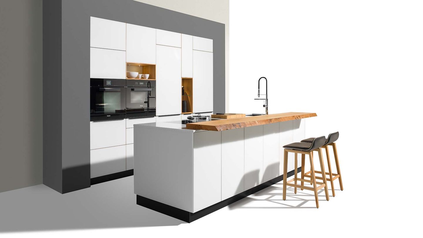 linee designer kitchen with coloured glass fronts in white