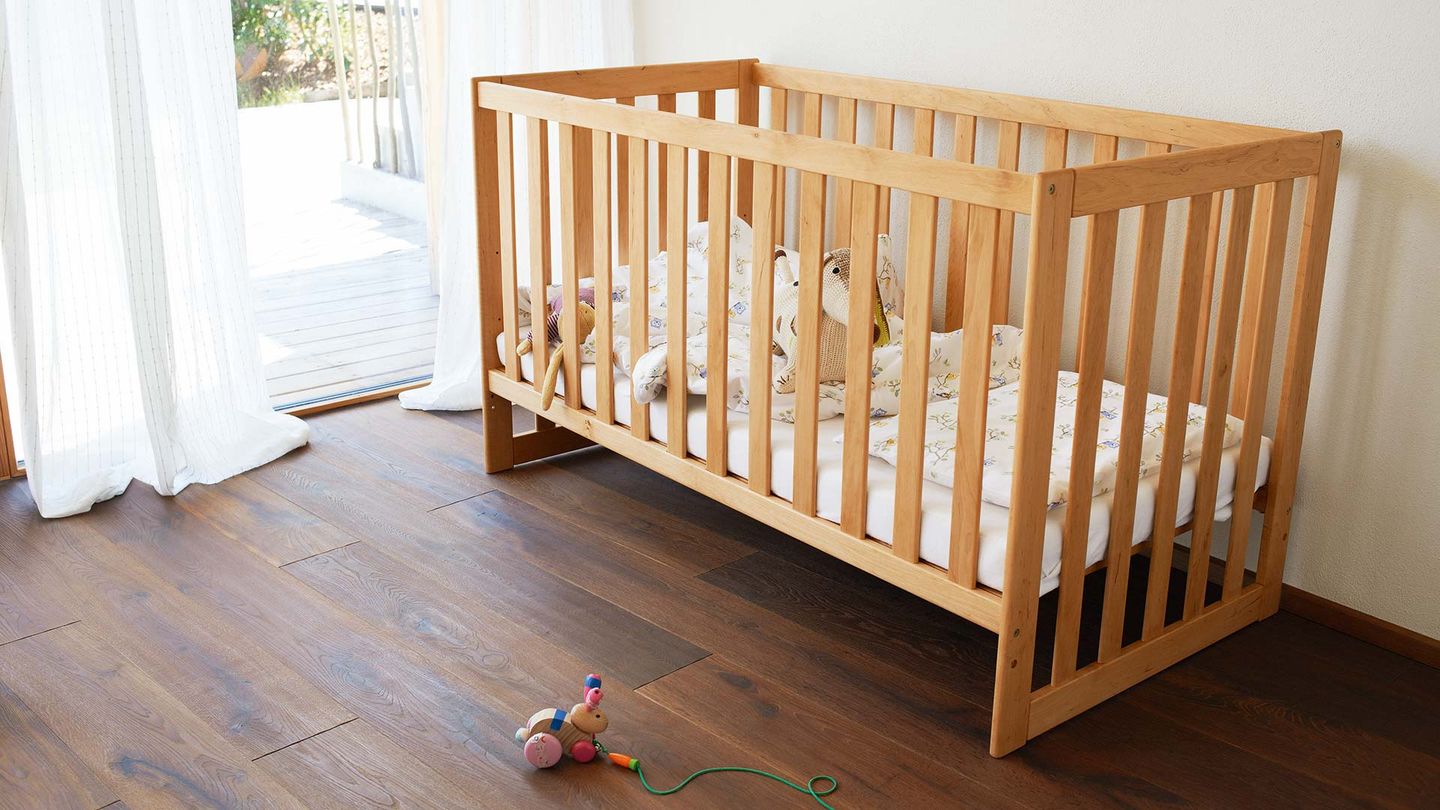 mobile child’s bed made of solid wood 