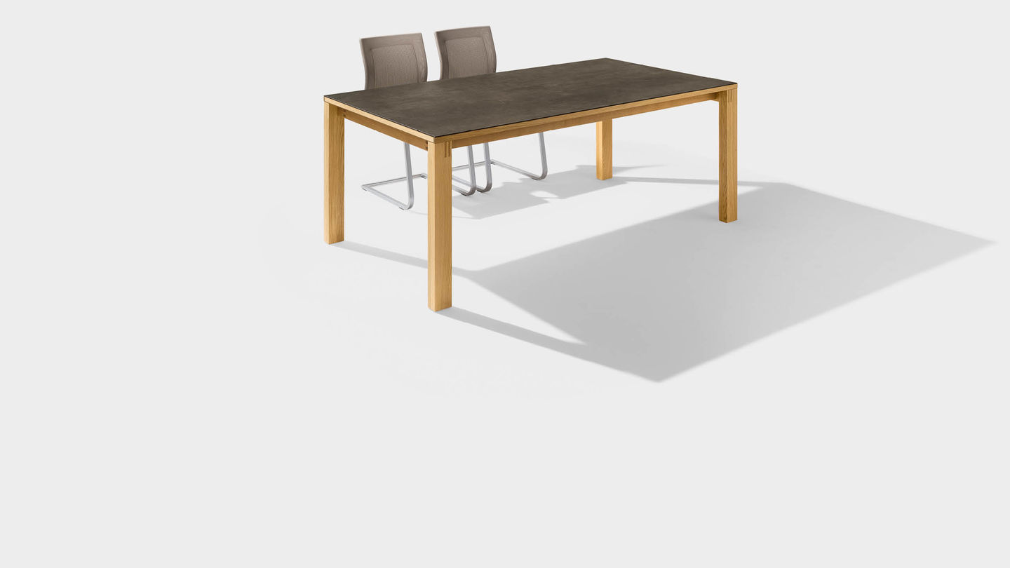 magnum dining table made of wood with ceramic surface