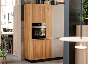 TEAM 7 high cabinet from the echt.zeit kitchen in oak in the TEAM 7 World Store Ried showroom