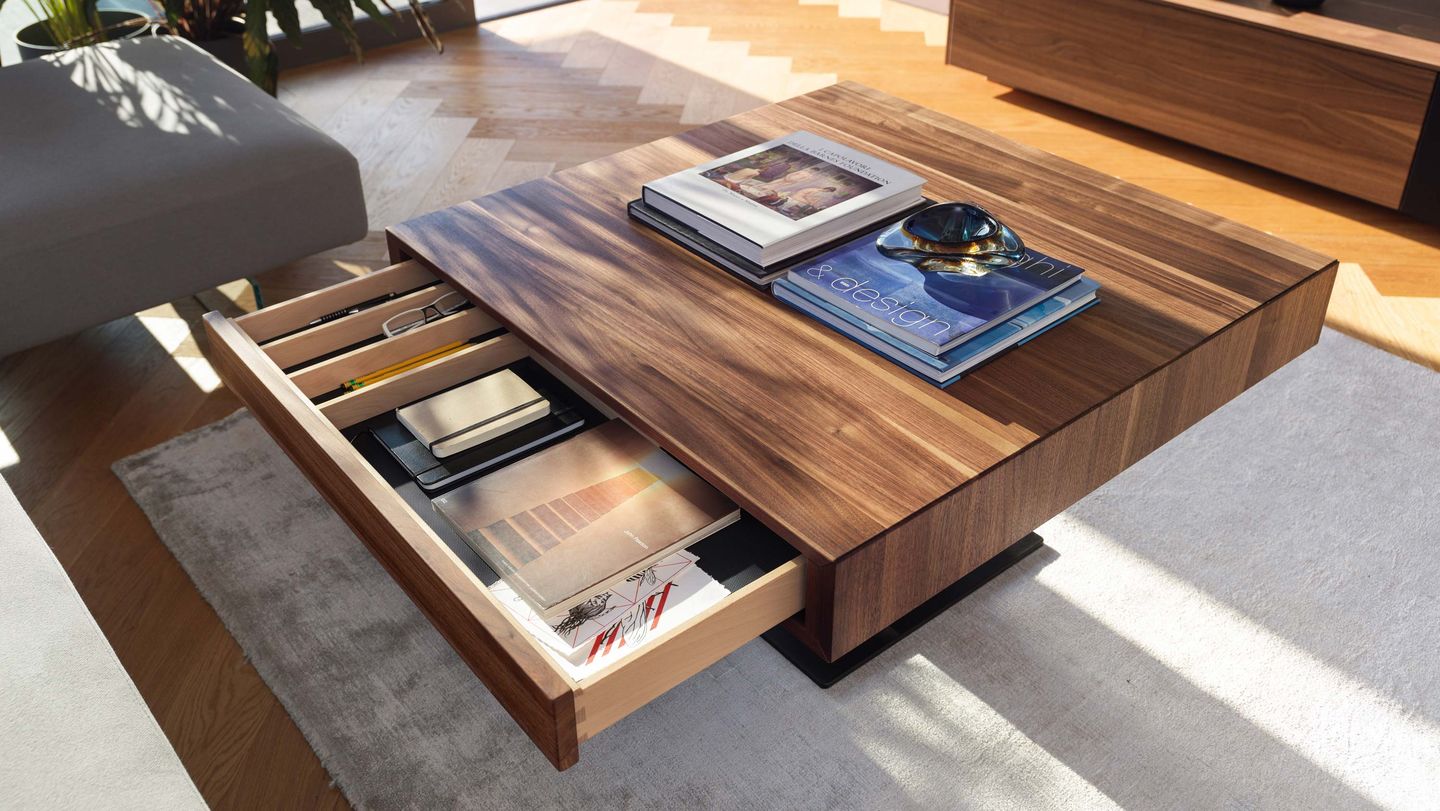 lift coffee table with open drawer in walnut