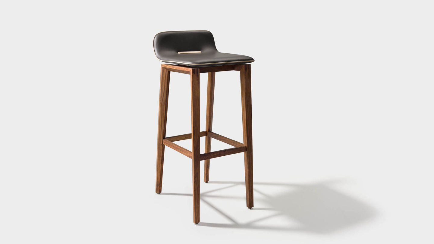 ark bar stool in leather with wooden legs in walnut
